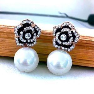 PEARL DROP EARRINGS WITH BLACK AND GOLD FLOWER TOP